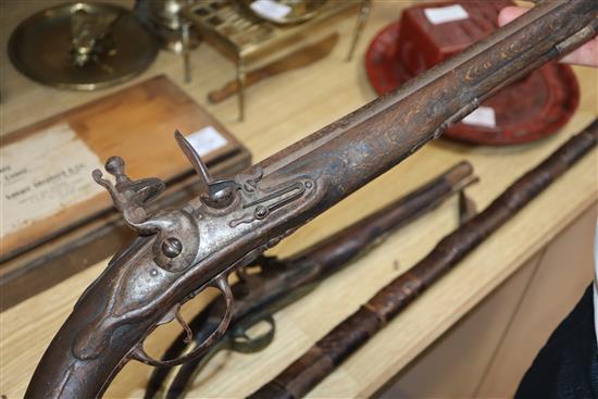 A Continental brass mounted flintlock pistol and another pistol and a rifle rifle 170cm